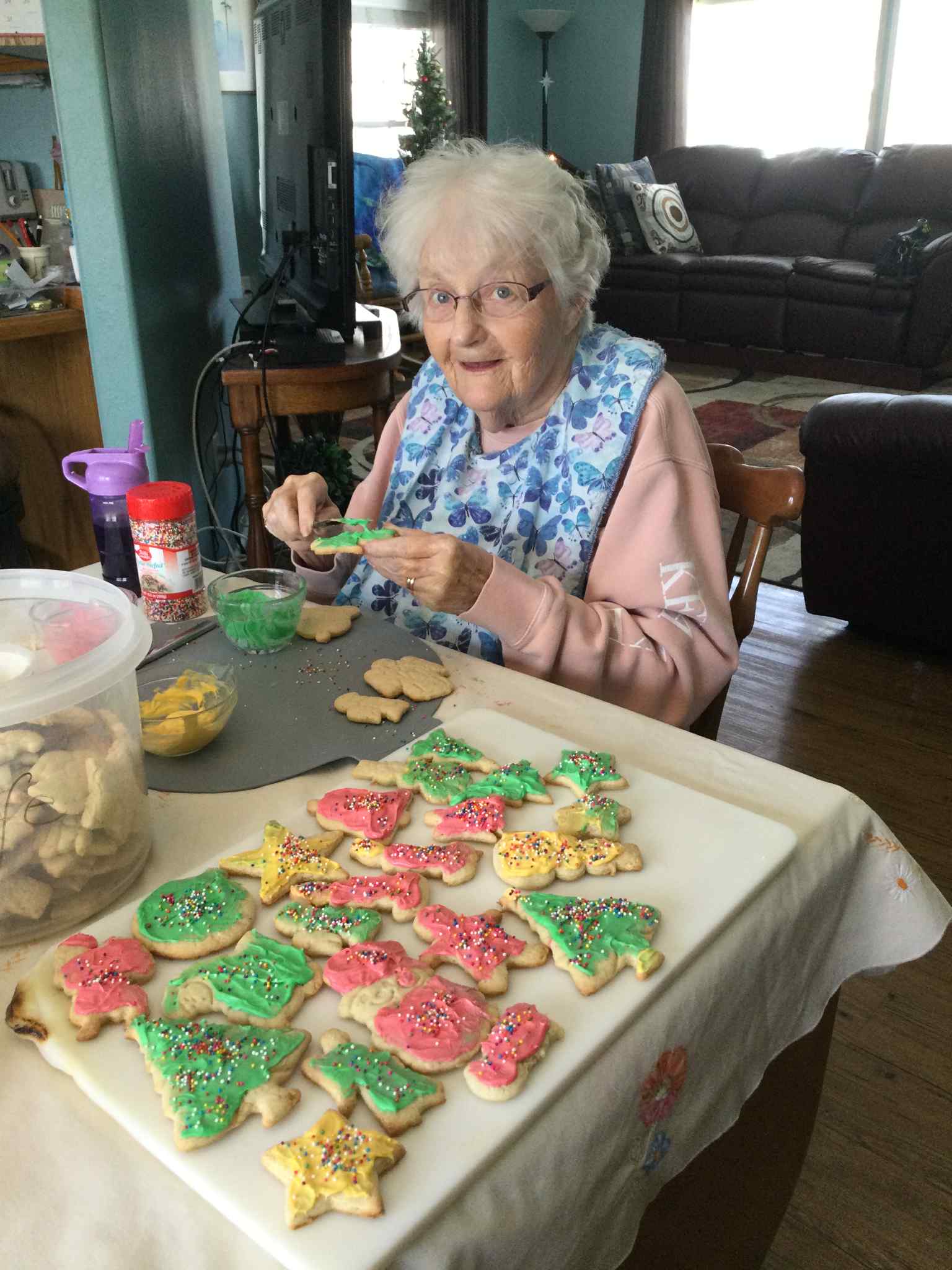 Senior decorating holiday cookies